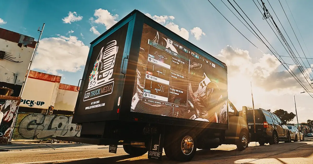 Mobile LED billboard vehicle displaying an advertising message