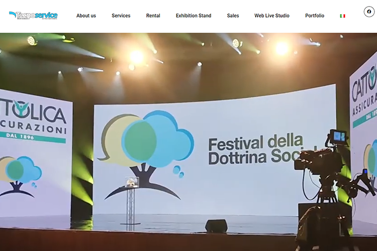 20 Tecnoservice by Verdari-LED Screen Manufacturer Stage with large screens and banners for Cattolica Assicurazioni at a festival, camera filming the event.