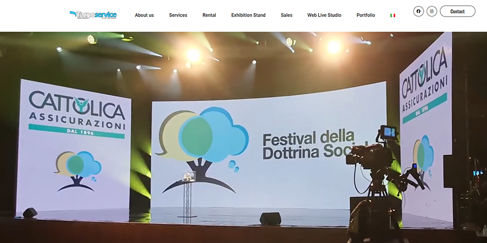20 Tecnoservice by VerdariLED Screen Manufacturer LED Display Manufacturer in China EagerLED Stage with large screens showing a tree and clouds logo and the text Festival della Dottrina Società banners for CATTOLICA ASSICURAZIONI on both sides a camera on a tripod on the right and a podium center stage