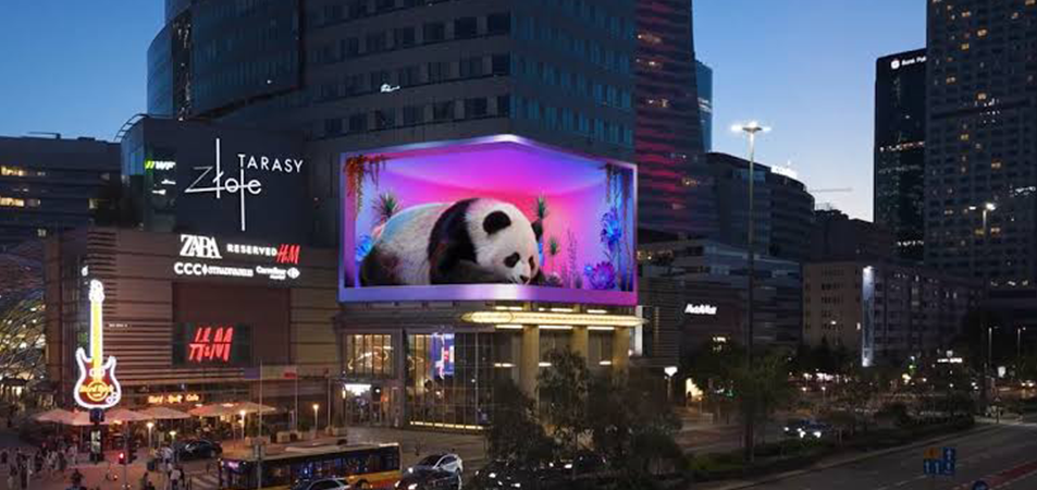 3D billboard1 LED Display Manufacturer in China EagerLED Evening city square with a large panda ad on a digital billboard and surrounding shop signs