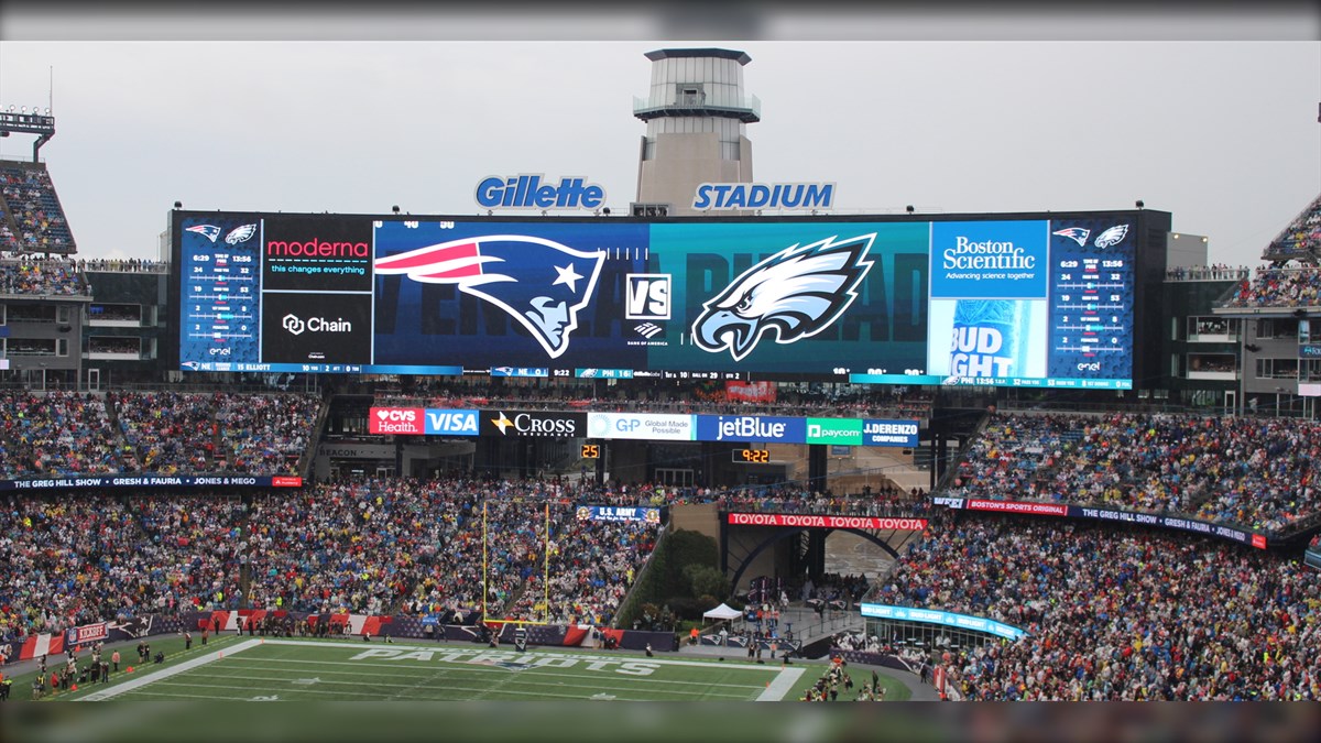 Gillette Stadium Display Biggest LED Screen Project LED Display Manufacturer in China EagerLED Gigantic stadium scoreboard at Gillette Stadium displaying Patriots vs Eagles logos over a packed crowd