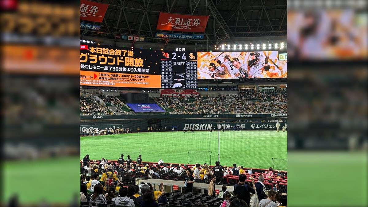 Mizuho PayPay Dome Hawks Vision Biggest LED Screen Project LED Display Manufacturer in China EagerLED Baseball stadium full of spectators watching a game with a large scoreboard and advertisement boards above the field Japanese text visible on signs and screens