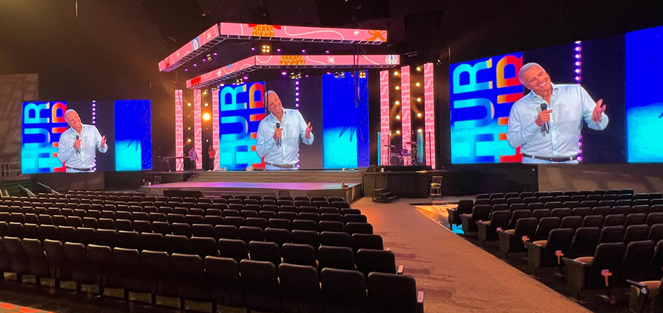 Stage LED Screen4 LED Display Manufacturer in China EagerLED Conference stage with a large LED wall and side screens showing a speaker