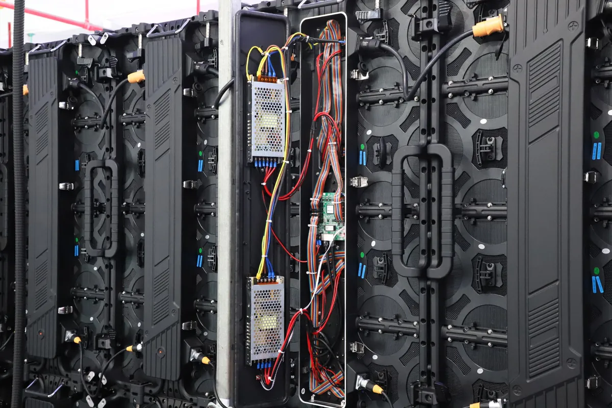 Rear of LED display cabinets with the power supplies, receiving card and wiring exposed