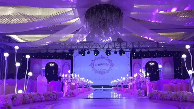 Interactive LED dance floor and LED screens in a wedding banquet hall