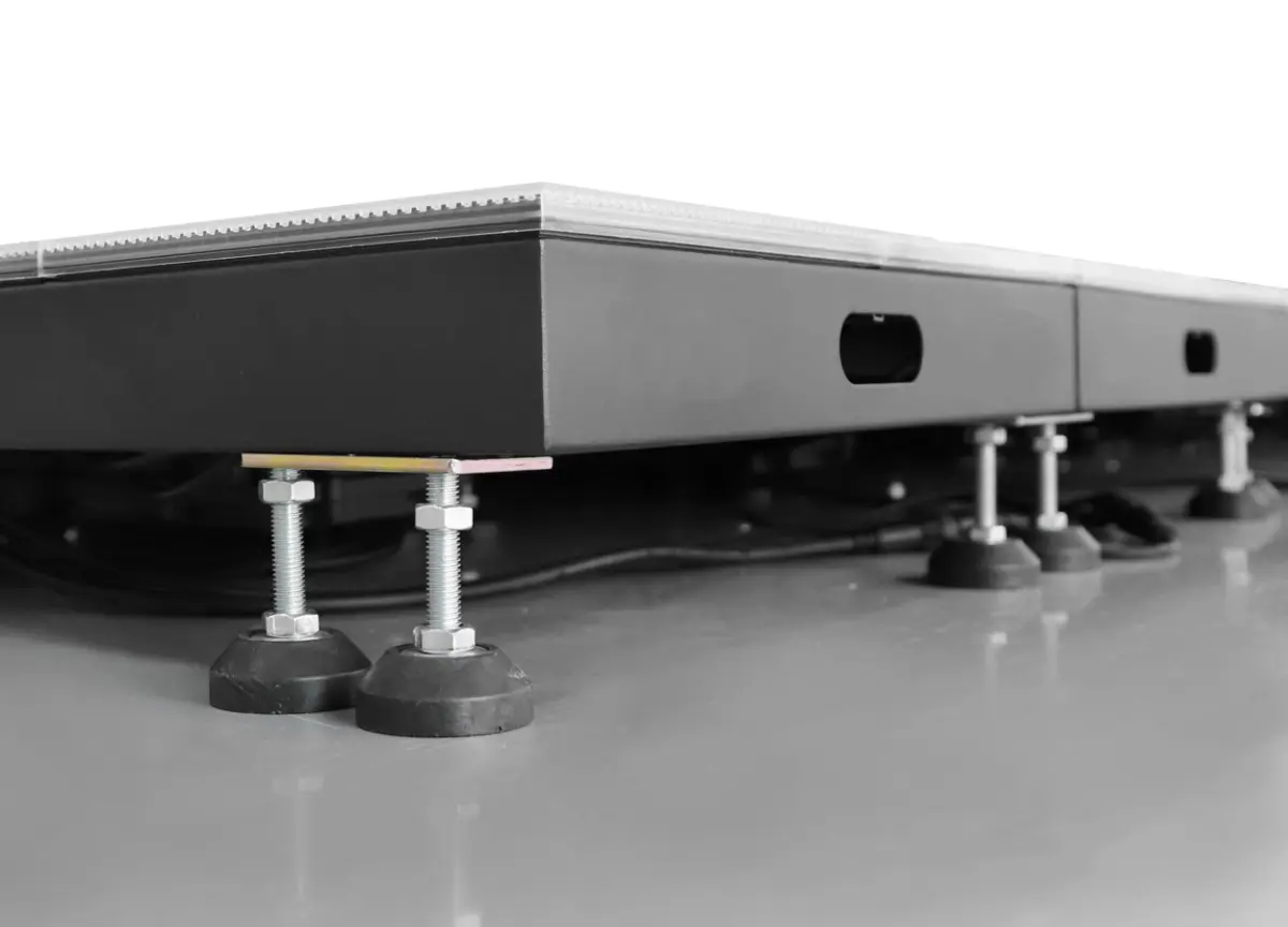 Raised LED floor platform standing on adjustable levelling feet