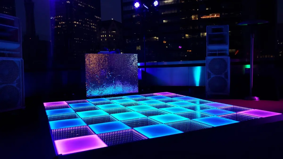 LED video dance floor with glowing tiles in a nightclub